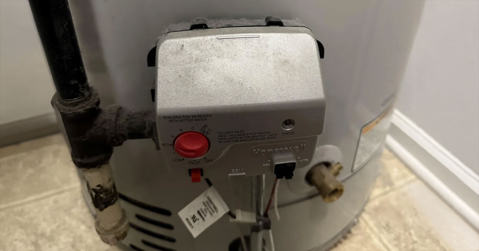 Gas control valve on the lower front of a tank water heater